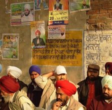 Congress Leader Dullo in Dhadhree Village, notice poster of Dhadhree Baba next to election ads